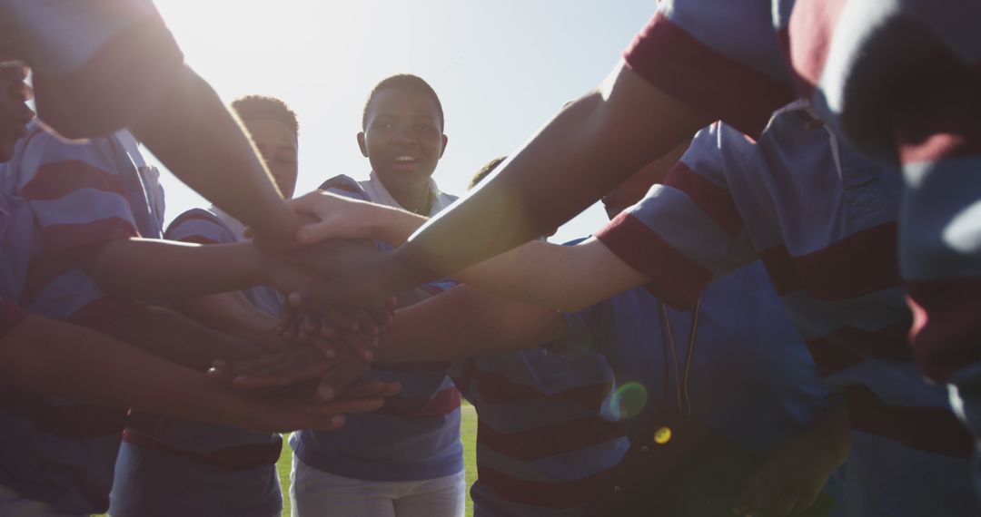 Team Huddle of Young Athletes Ready for Game Under Sunlight - Free Images, Stock Photos and Pictures on Pikwizard.com