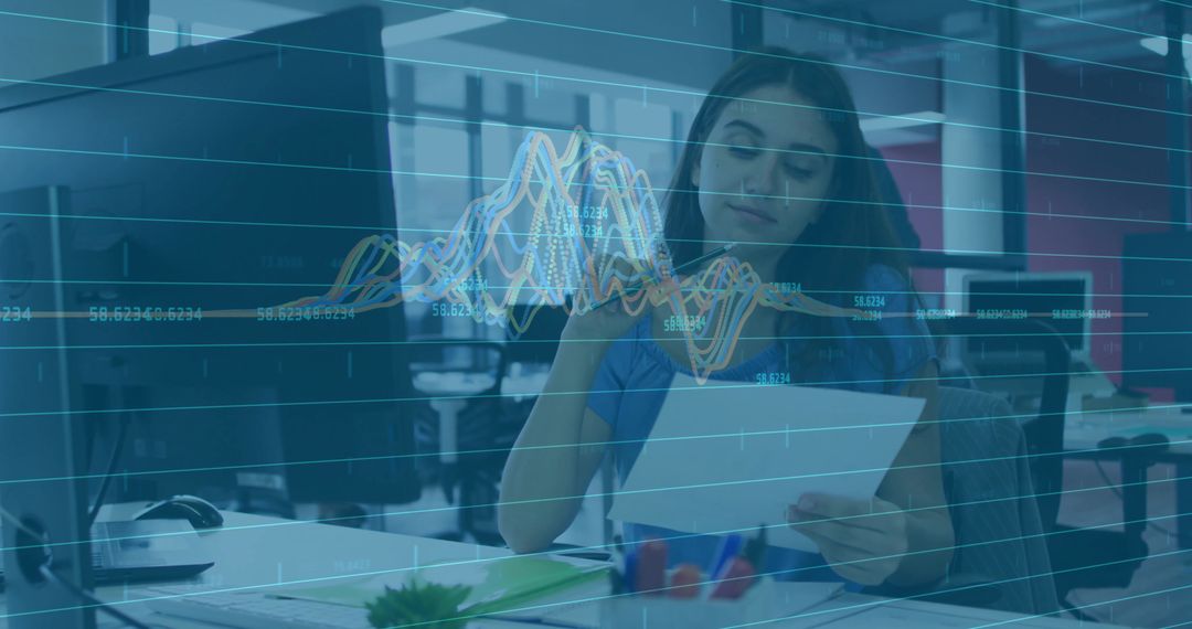 Woman Reviewing Financial Report and Annotating Data with Digital Graph Overlay