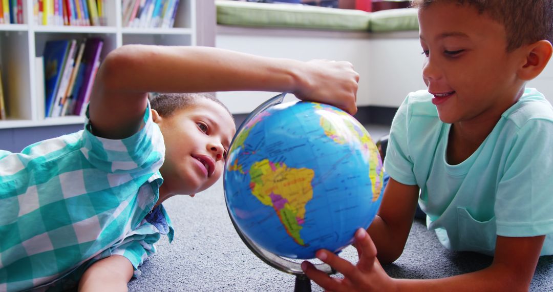 Two Curious Children Exploring Globe in Classroom - Free Images, Stock Photos and Pictures on Pikwizard.com