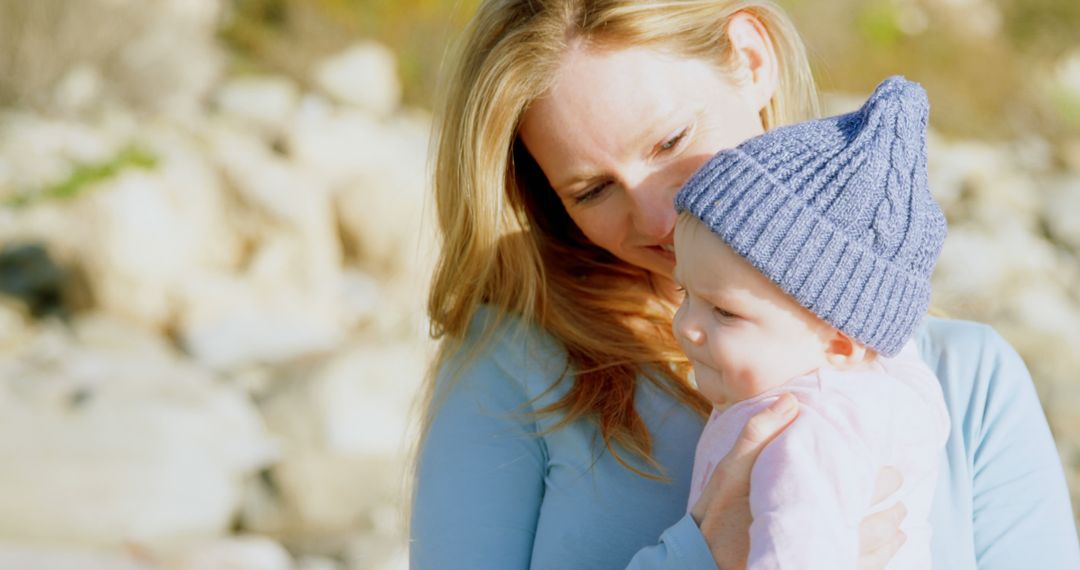 Mother Holding Baby Outdoors in Autumn - Free Images, Stock Photos and Pictures on Pikwizard.com