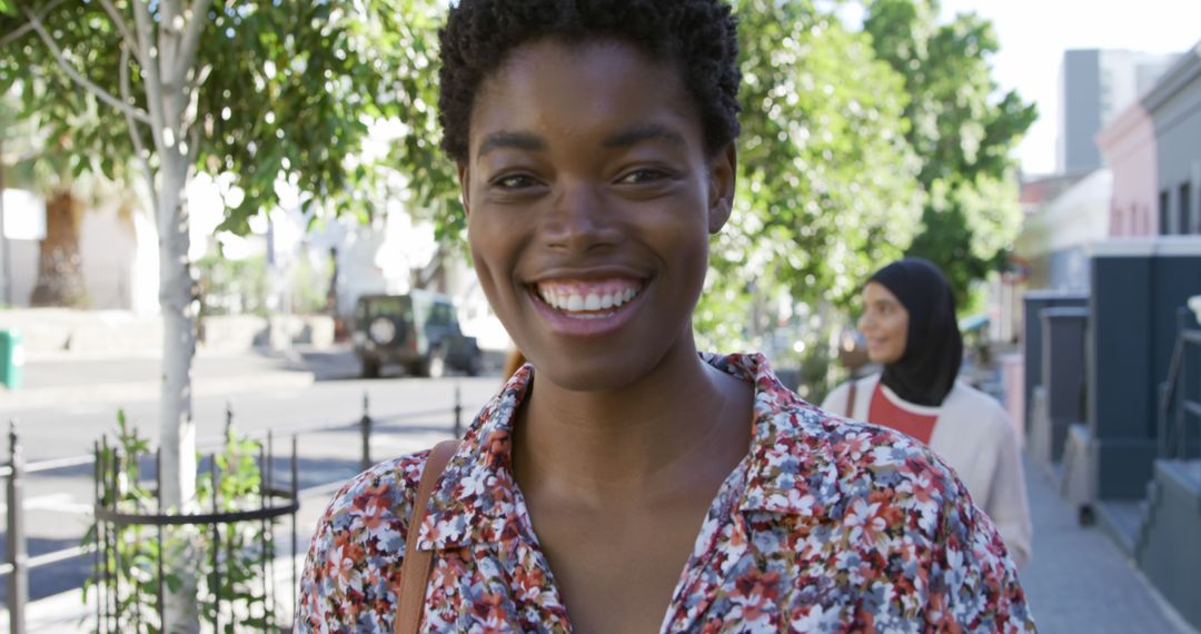 Cheerful African American Woman Smiling Outdoors in Summer - Free Images, Stock Photos and Pictures on Pikwizard.com