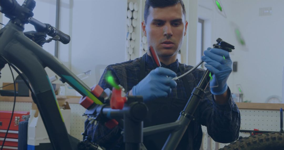Skilled Male Bicycle Technician Repairing Bike in Workshop