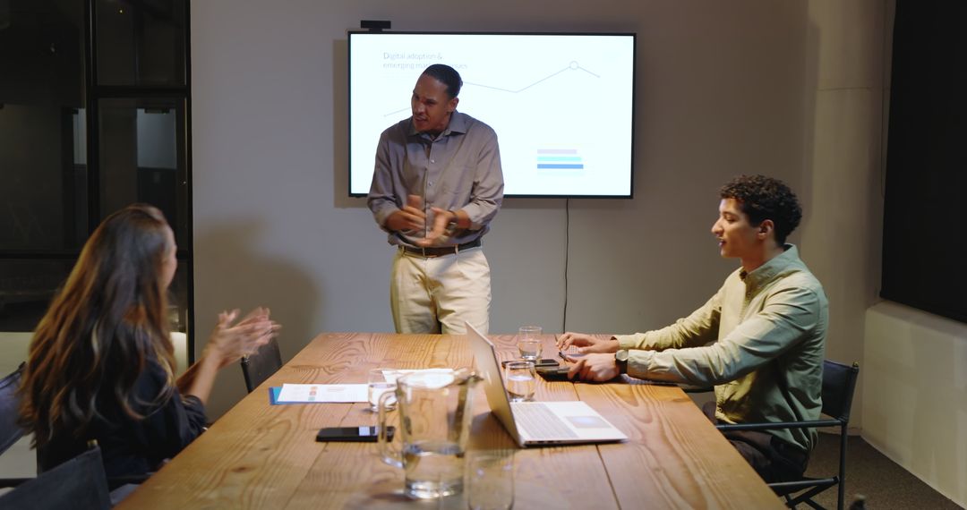 Diverse Team Collaborates on Business Strategy in Modern Conference Room