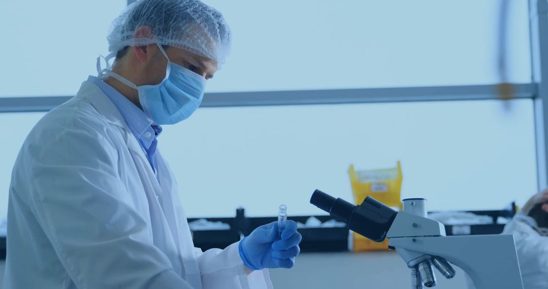 Scientist Conducting Research with Microscope in Lab