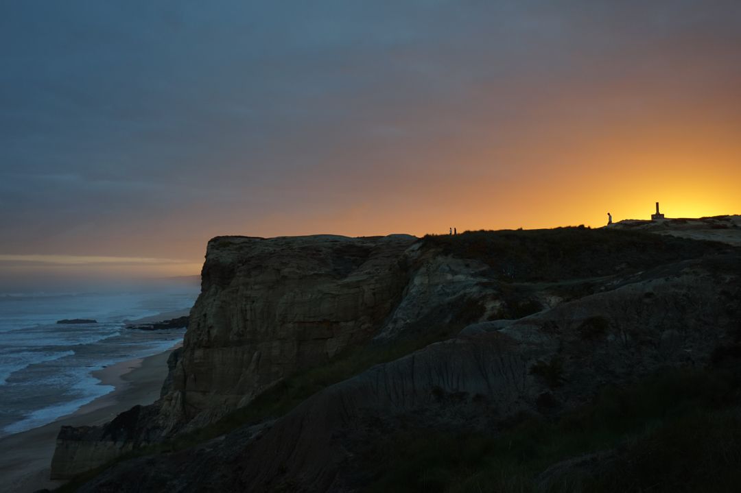 Dramatic Coastal Cliff with Sunset Sky and Ocean Waves - Free Images, Stock Photos and Pictures on Pikwizard.com