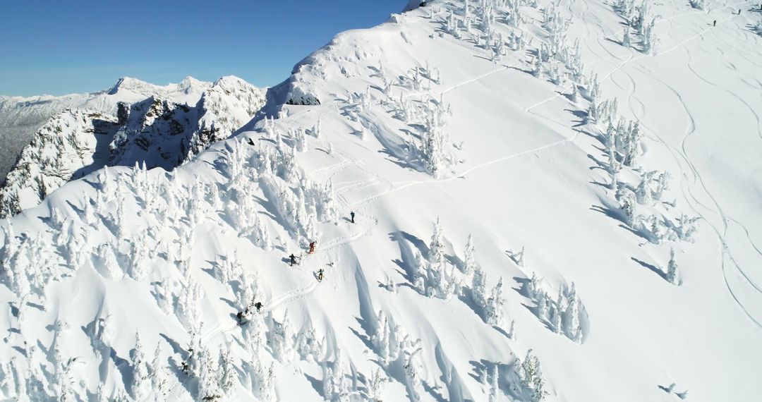 Snow Covered Mountain Ridge with Skiers and Snowboarders - Free Images, Stock Photos and Pictures on Pikwizard.com