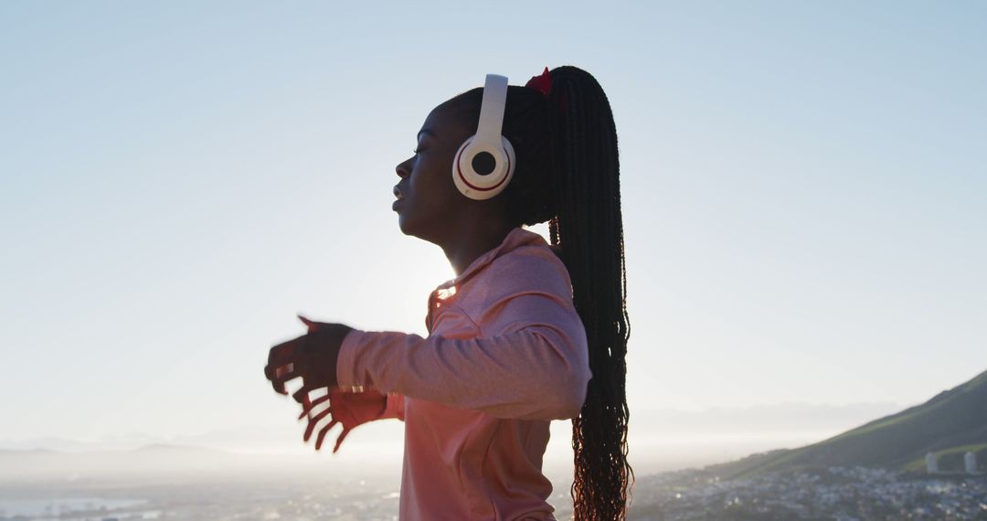 Young Black Woman Exercising Outdoors with Headphones - Free Images, Stock Photos and Pictures on Pikwizard.com