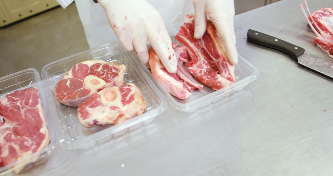 Butcher Preparing Fresh Cuts of Meat in Packaging - Free Images, Stock Photos and Pictures on Pikwizard.com