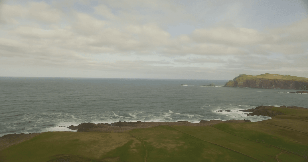 Breathtaking Cliffs and Ocean Under Transparent Sky