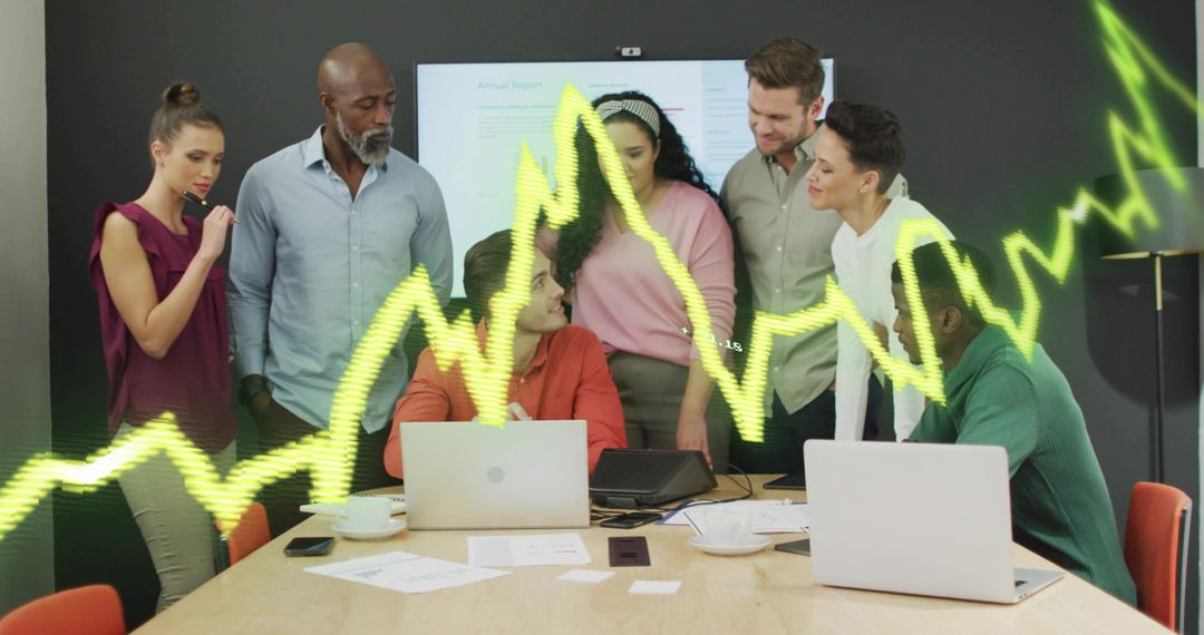 Team Reviewing Report with Digital Analytics Visuals