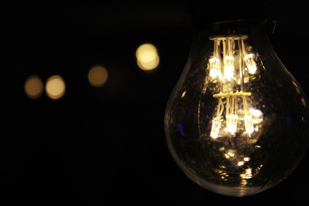 Close-up of Glowing Light Bulb with Bokeh Background - Free Images, Stock Photos and Pictures on Pikwizard.com