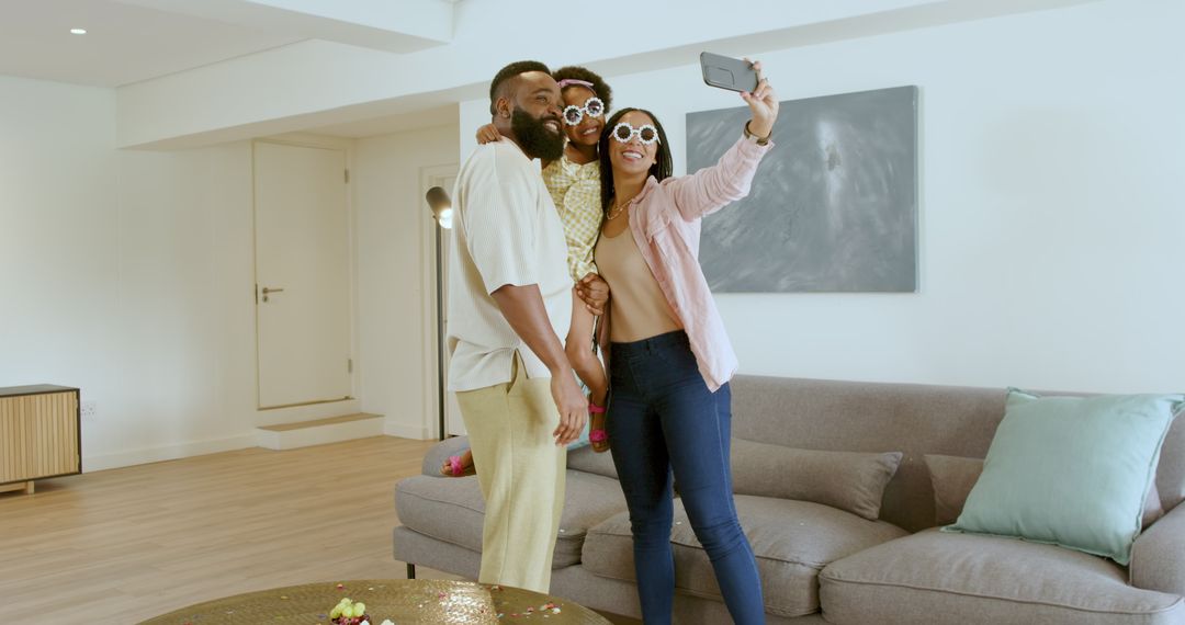 Happy Family Taking Selfie Together in Living Room Celebration
