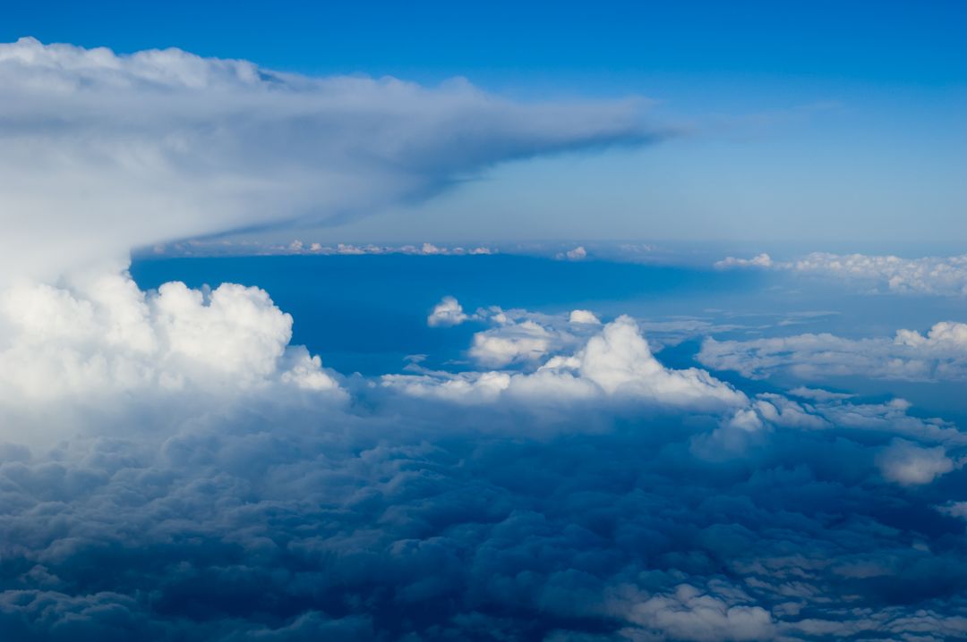 Aerial View of Majestic Clouds in Blue Sky - Free Images, Stock Photos and Pictures on Pikwizard.com