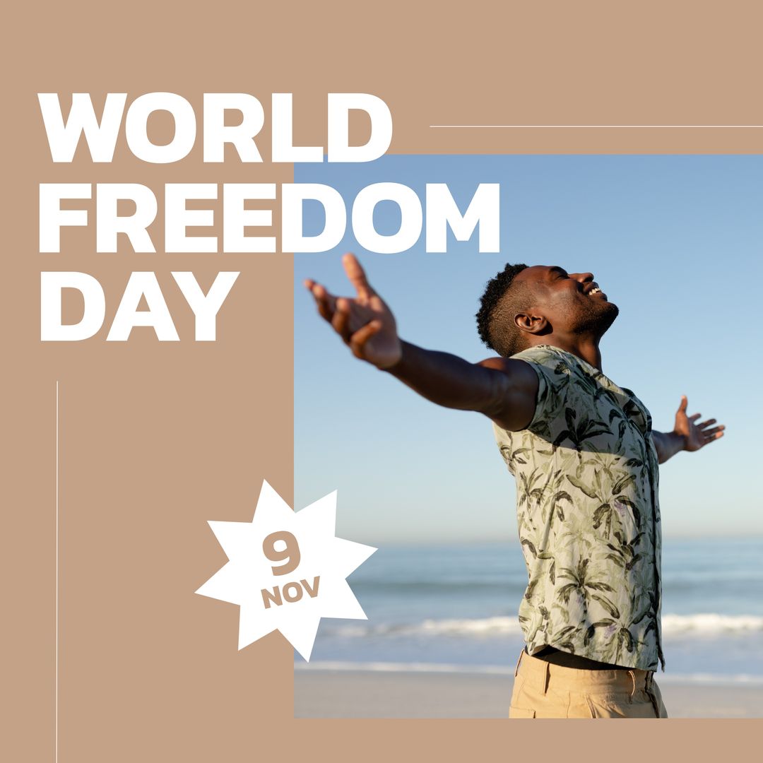 Happy african american young man with arms outstretched standing at beach, world freedom day text - Download Free Stock Templates Pikwizard.com