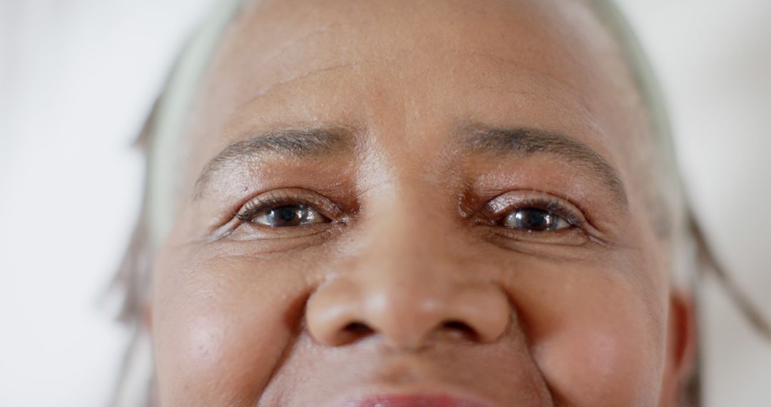 Closeup of Elderly Woman's Face with Smiling Eyes - Free Images, Stock Photos and Pictures on Pikwizard.com