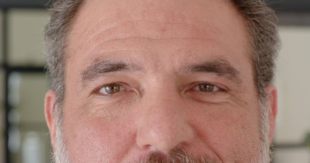 Senior Gentleman Displaying Thoughtful Expression Looking Forward