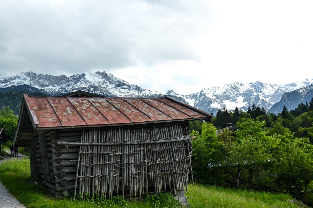 Rustic Cabin in Mountainous Landscape with Snow-Capped Peaks - Free Images, Stock Photos and Pictures on Pikwizard.com