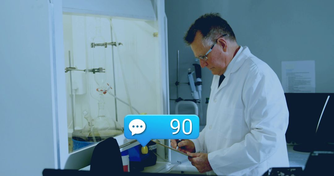 Researcher consulting tablet beside fume hood with lab glassware and notification overlay