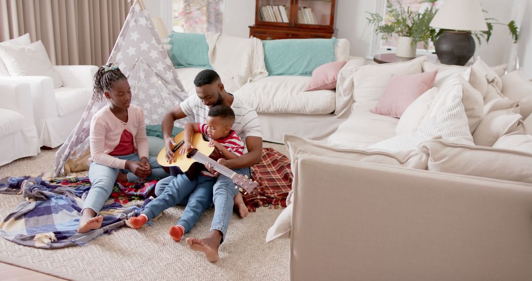 Father Teaching Guitar to His Kids in Cozy Living Room - Free Images, Stock Photos and Pictures on Pikwizard.com