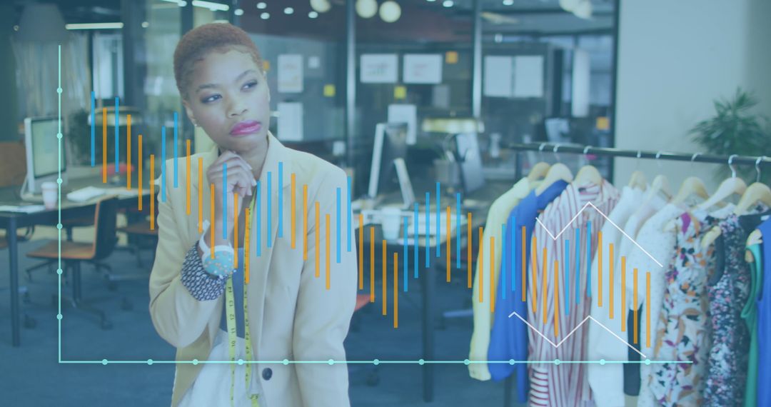 Businesswoman Analyzing Financial Graphs in Creative Workspace