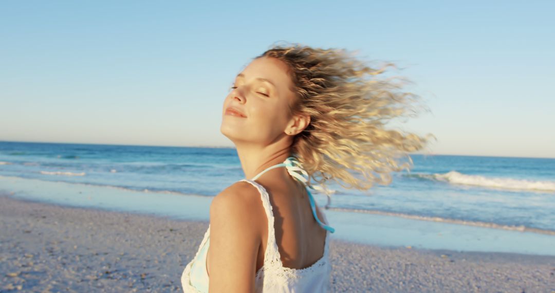 Woman Enjoying Beach Breeze with Closed Eyes in Early Evening - Free Images, Stock Photos and Pictures on Pikwizard.com