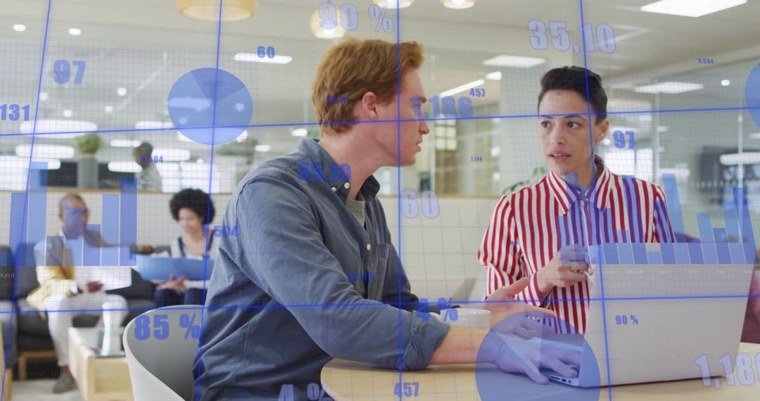 Colleagues Analyzing Data Trends With Overlay Charts at Office