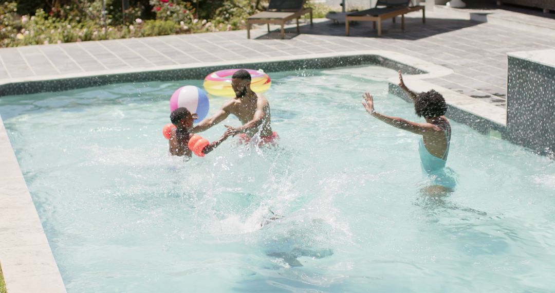 Family Enjoying Fun Summer Day at Pool with Splashing Children