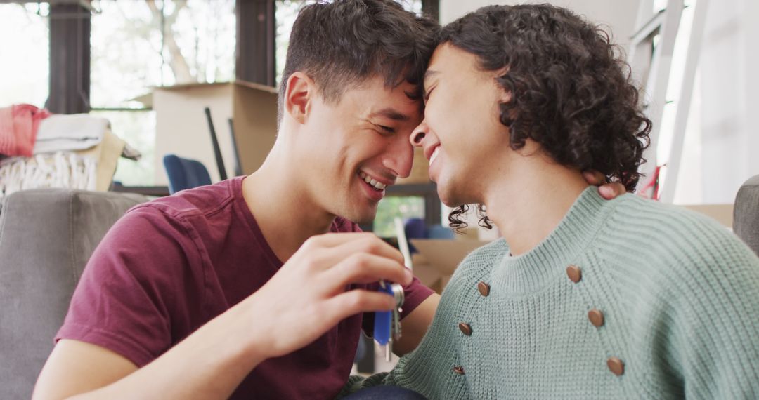 Joyous Couple Embracing with New House Keys