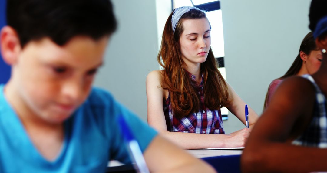 Students Concentrating During Classroom Exam - Free Images, Stock Photos and Pictures on Pikwizard.com