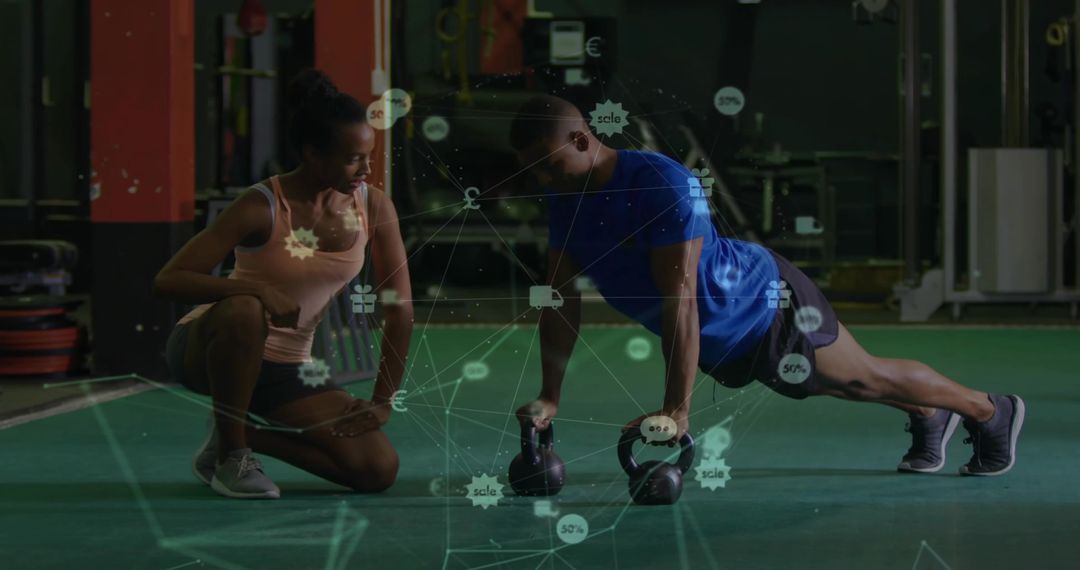 Trainer Coaching Client on Push-Ups with Kettlebells