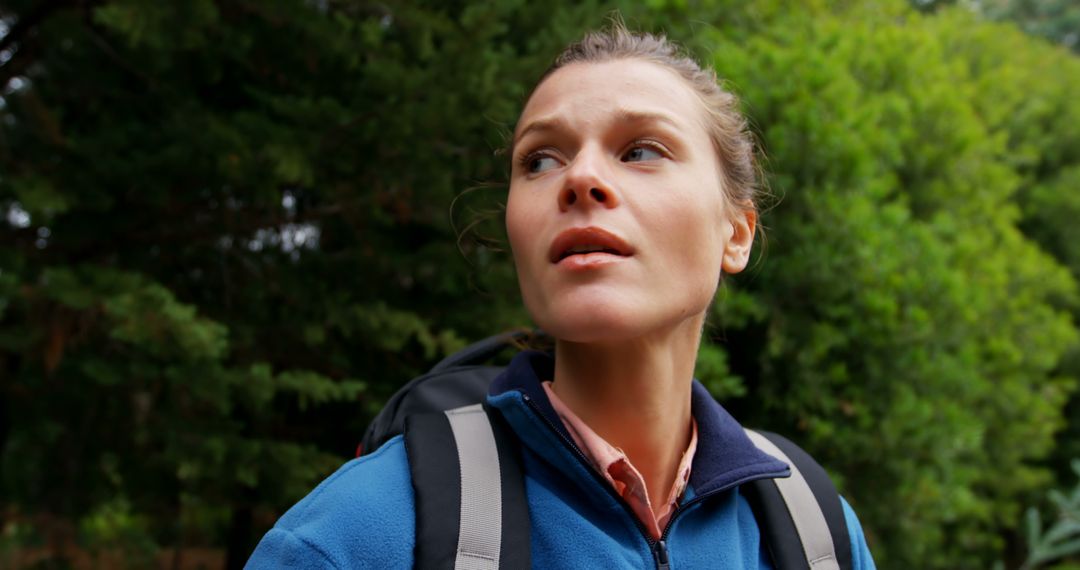 Woman Hiking in Forest, Looking at Something Off-Camera - Free Images, Stock Photos and Pictures on Pikwizard.com