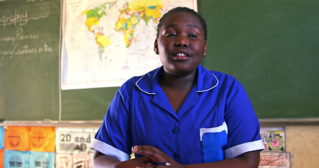 Female Student in Blue Uniform Studying in Classroom - Free Images, Stock Photos and Pictures on Pikwizard.com