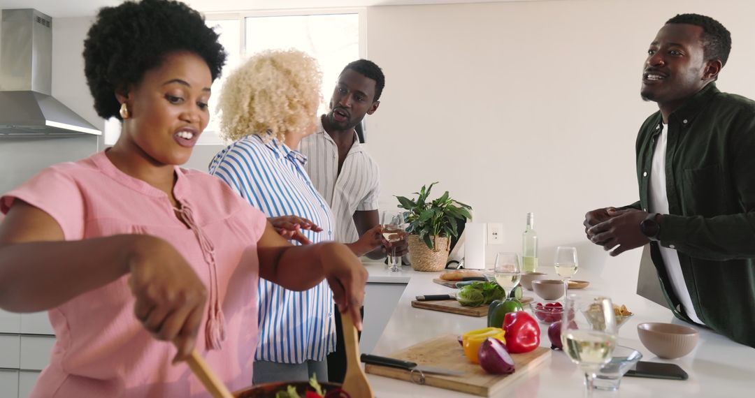 Friends Socializing in Modern Kitchen While Cooking Together