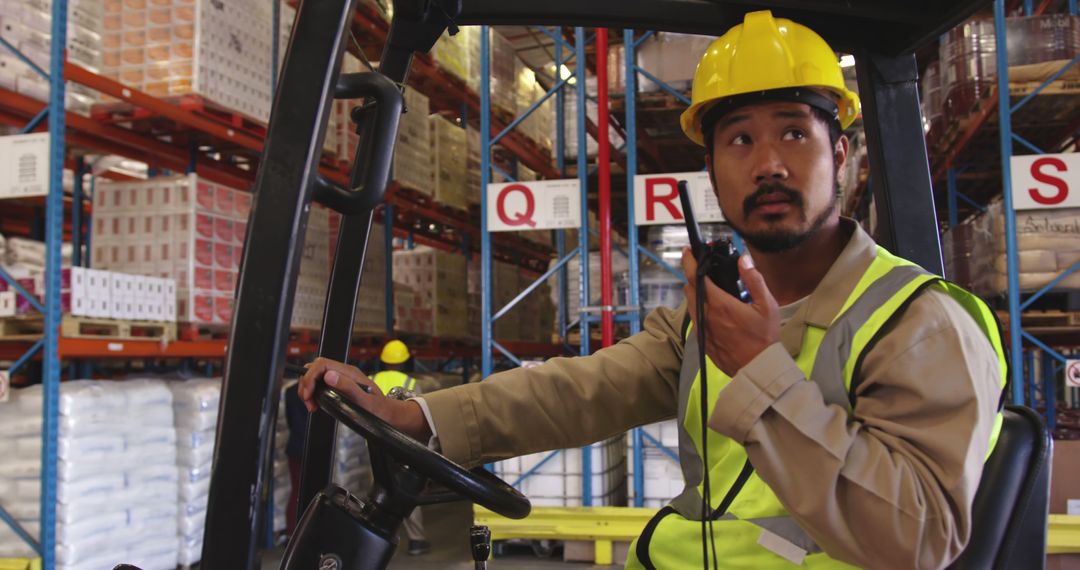 Forklift Operator Using Walkie-Talkie in Warehouse - Free Images, Stock Photos and Pictures on Pikwizard.com