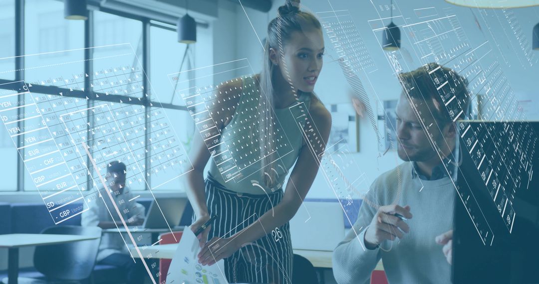 Young professionals collaborating with holographic analytics in modern open office