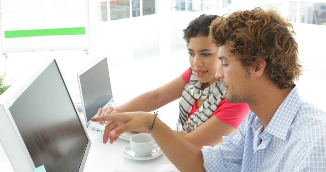 Collaboration Between Creative Designers at Office Workspace