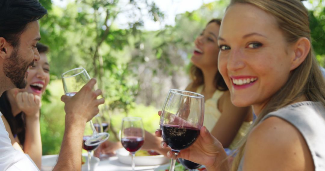 Smiling Friends Enjoying Outdoor Wine Tasting Event