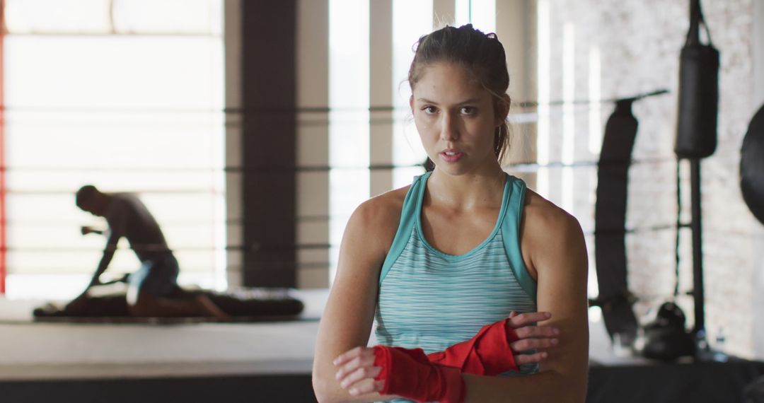 Female Boxer Wrapping Hands in Boxing Gym - Free Images, Stock Photos and Pictures on Pikwizard.com