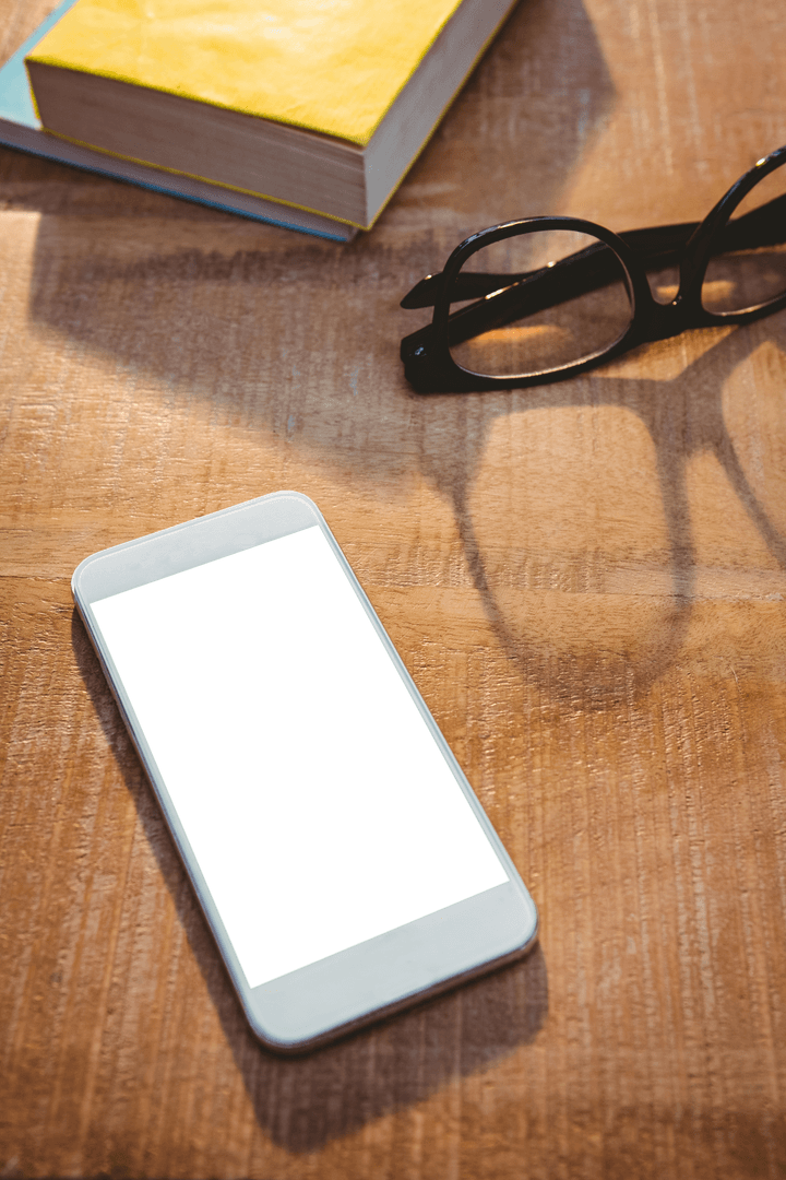 Transparent Smartphone with Glasses on Wooden Table