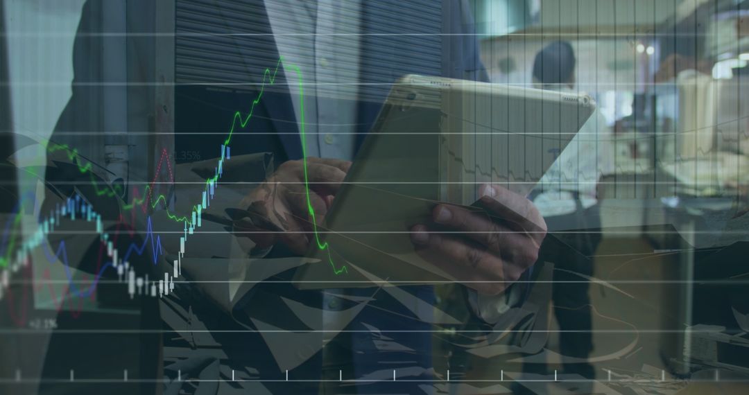 Businessman Analyzing Financial Charts on Tablet