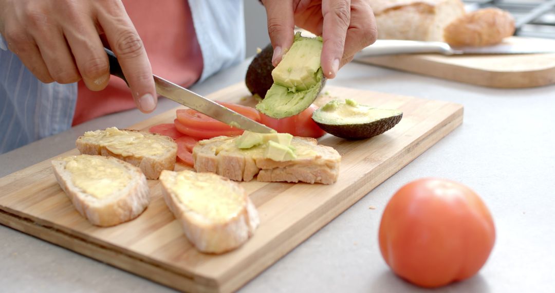 Preparing Healthy Avocado and Tomato Sandwich
