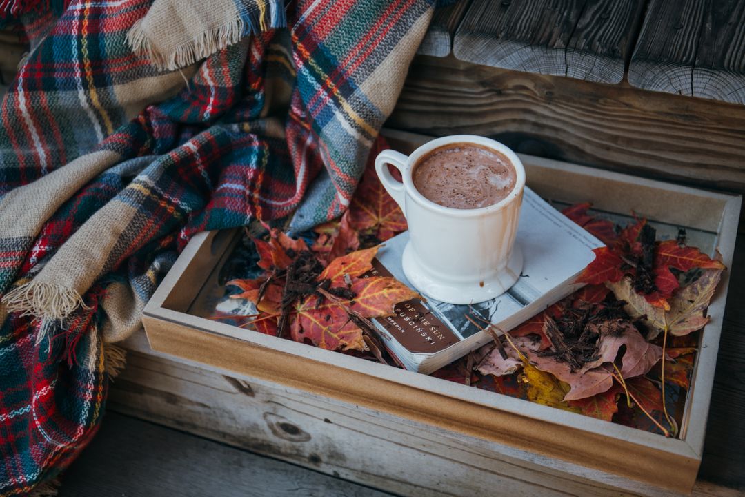 Cozy Autumn Scene with Hot Chocolate and Colorful Leaves - Free Images, Stock Photos and Pictures on Pikwizard.com