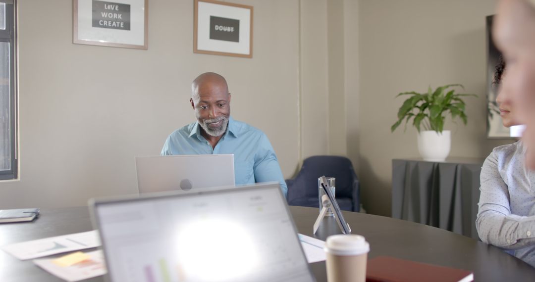 Diverse Team Collaborates at Office Conference Meeting