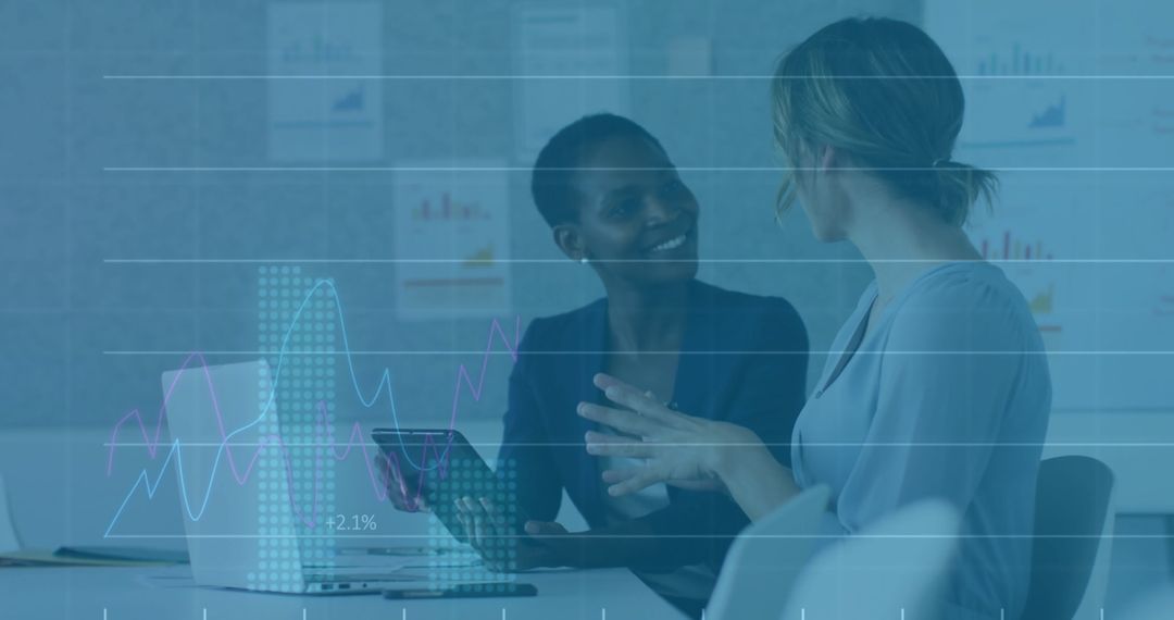 Professional Colleagues Engaging in Business Discussion with Technology