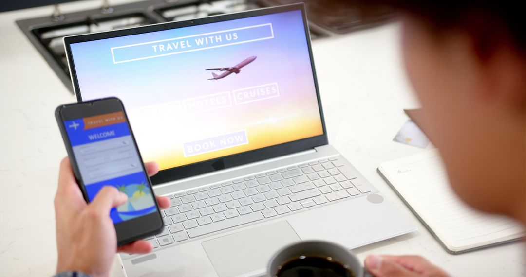 Man Booking Travel Online Using Smartphone and Laptop