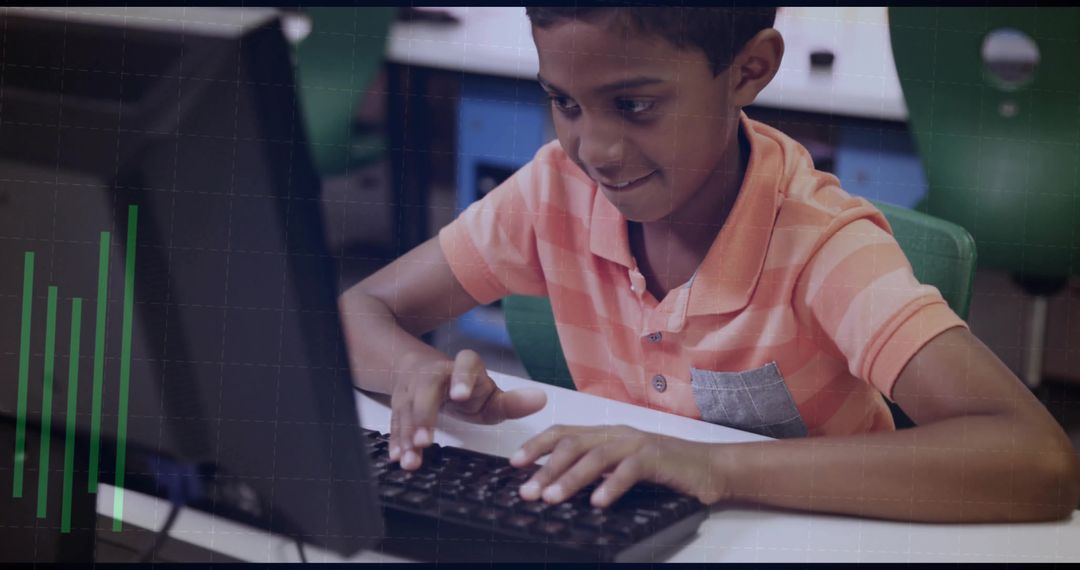 Young Student Typing on Desktop Computer in Classroom Learning Coding and Digital Skills