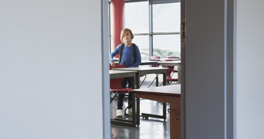 Young Student Entering Classroom, Ready to Learn