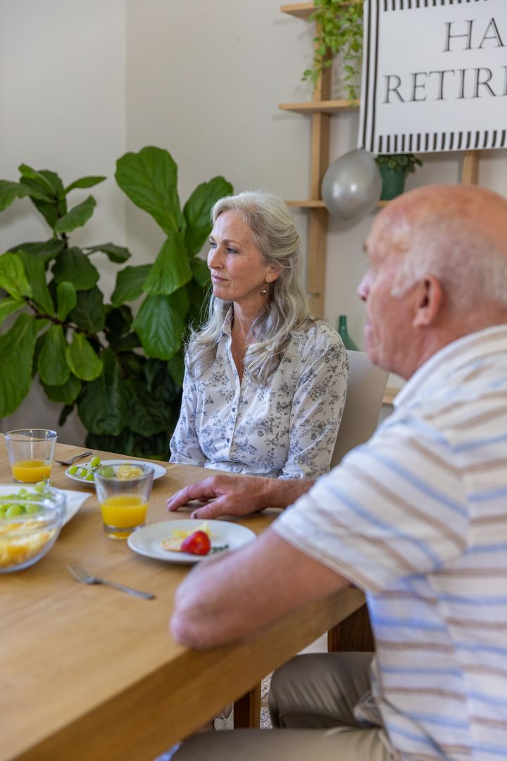 Senior Couple Enjoying Cozy Breakfast Together at Home
