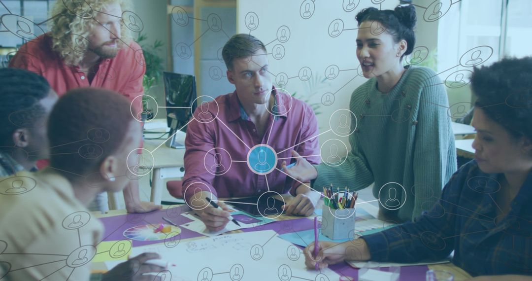 Diverse Team Collaborating on Network Solutions in Modern Office