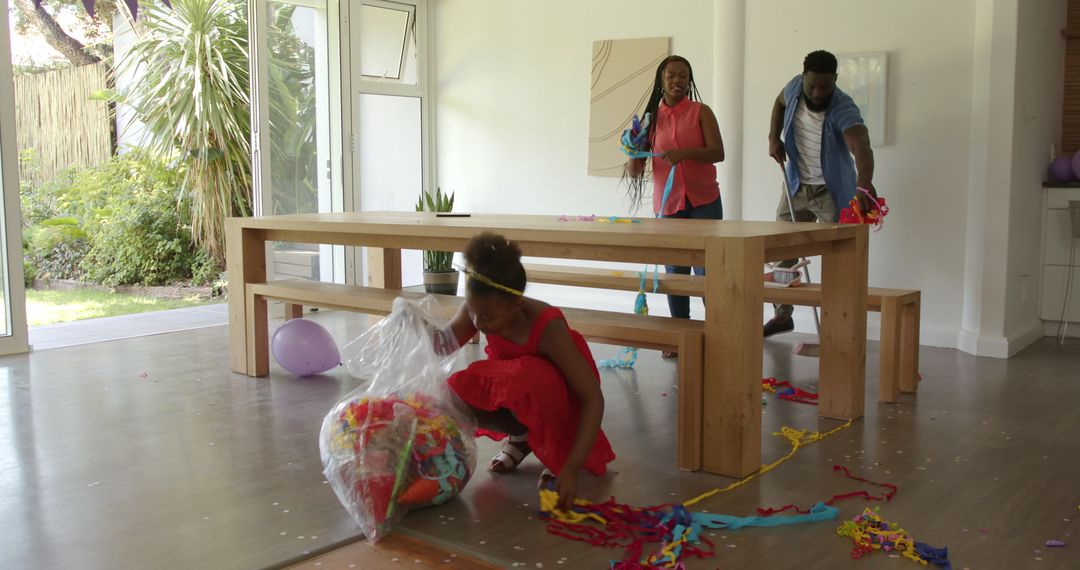 Family Collaborating on Post-Party Clean Up Chores at Home
